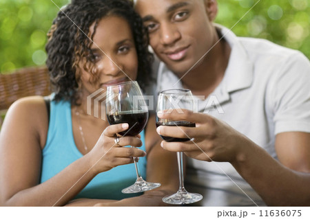 African couple toasting with wine 11636075