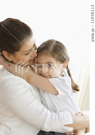 Portrait of mother and young daughter hugging Portrait of mother and young daughter hugging 11636113