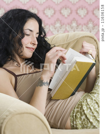 Young woman reading a book Young woman reading a book 11636158
