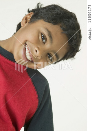Indian boy bending head to side 11636175
