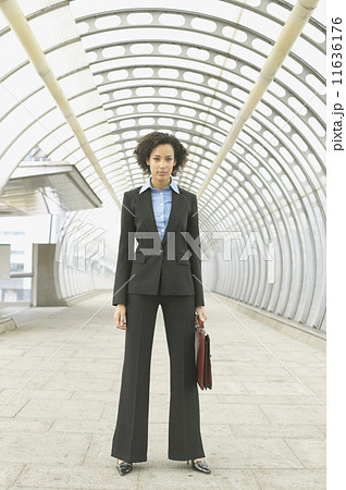 Full length portrait of businesswoman in walkway Full length portrait of businesswoman in walkway 11636176