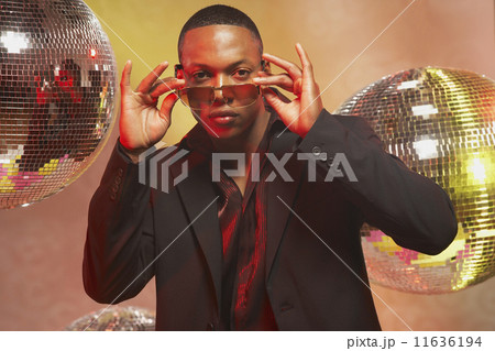 African American man putting on sunglasses 11636194