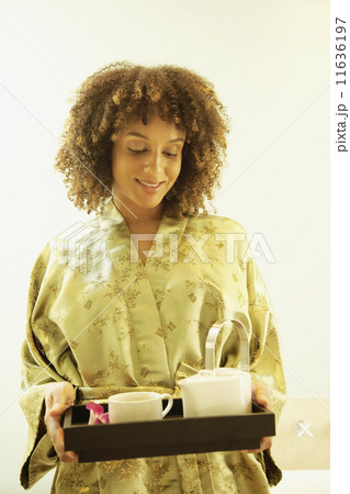 African American woman carrying tea tray 11636197