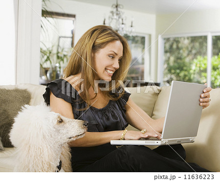 Hispanic woman looking at laptop 11636223