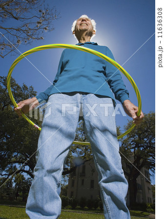 Low angle view of senior man with plastic hoop 11636308
