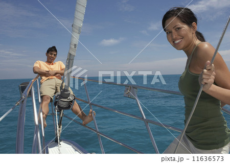 Multi-ethnic couple on sailboat Multi-ethnic couple on sailboat 11636573
