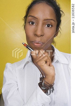 African woman holding pen 11636582