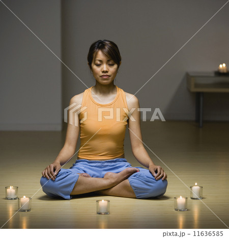 Pacific Islander woman meditating 11636585