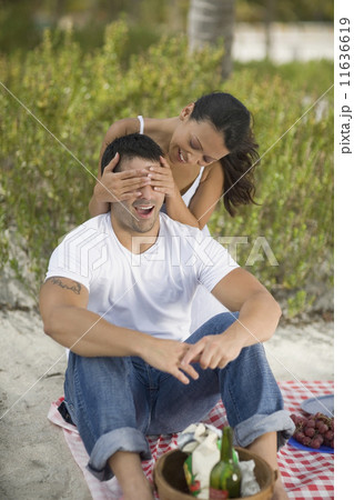 Hispanic couple having picnic 11636619