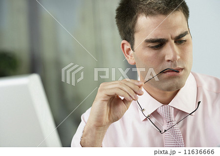 Middle Eastern businessman holding eyeglasses Middle Eastern businessman holding eyeglasses 11636666