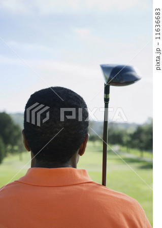 African man holding golf club 11636683