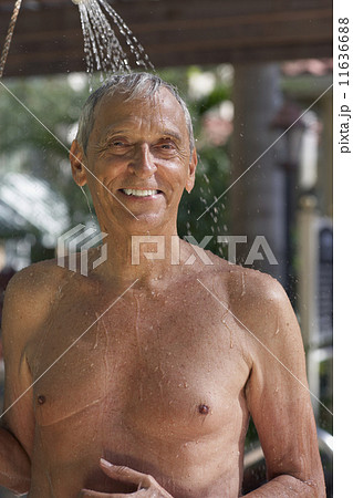 Senior man in outdoor shower 11636688