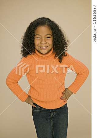 Pacific Islander girl with hands on hips 11636837