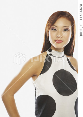 Asian woman wearing polka dot shirt Asian woman wearing polka dot shirt 11636878