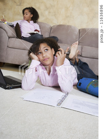 African twin sisters doing homework 11636896
