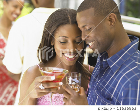 Couple having drinks together 11636963