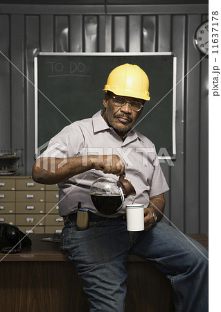 Senior African American male worker drinking coffee Senior African American male worker drinking coffee 11637178