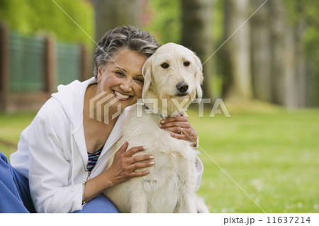 African American woman hugging dog African American woman hugging dog 11637214