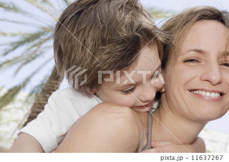 Mother and son hugging Mother and son hugging 11637267
