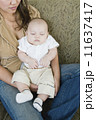 Asian mother holding sleeping baby 11637417