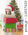 Girl holding presents 11637420