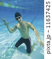Underwater shot of Asian man waving 11637425