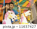 Couple riding a rollercoaster 11637427