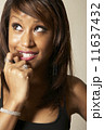 African American woman biting finger 11637432