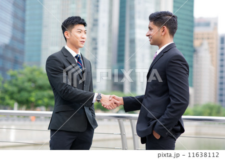 Partners sealing cooperation or agreement with a handshake - Large Partners sealing cooperation or agreement with a handshake - Large 11638112