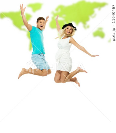 Beautiful smiling young couple jumping against world map Beautiful smiling young couple jumping against world map 11640467
