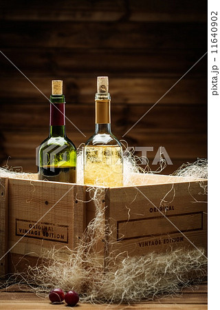 Bottle of red and white wine in wooden box Bottle of red and white wine in wooden box 11640902