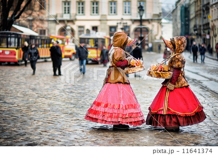 two woman in traditional clothes standing in the square in old city Lvov 11641374