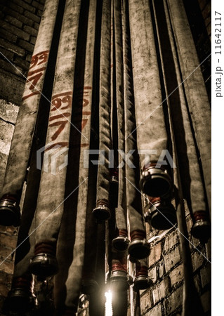 Storage room in firefighting depot with water hoses 11642117