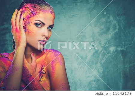 Beautiful young woman with conceptual colourful body art 11642178