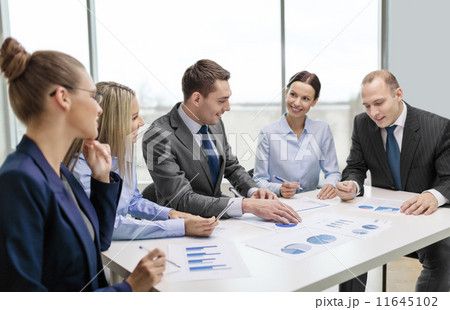 smiling business team at meeting smiling business team at meeting 11645102