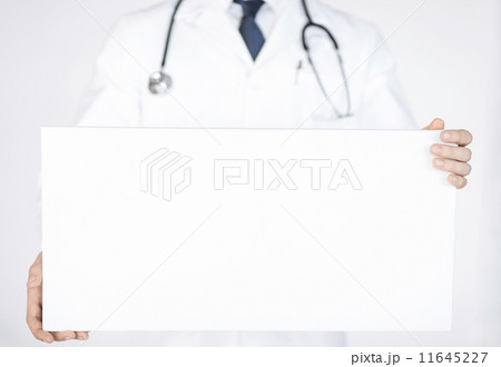 doctor holding blank white banner doctor holding blank white banner 11645227