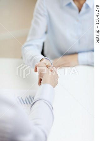 businesswoman and businessman shaking hands 11645279