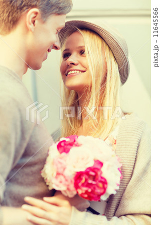 happy couple with flowers in the city happy couple with flowers in the city 11645566
