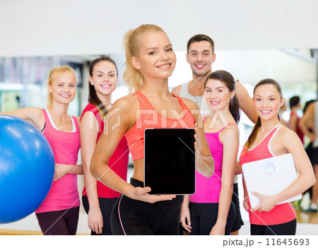 smiling woman showing tablet pc blank screen 11645693