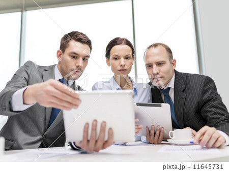 business team with tablet pc having discussion business team with tablet pc having discussion 11645731
