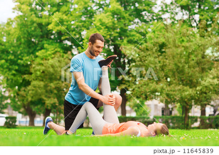 smiling couple stretching outdoors 11645839