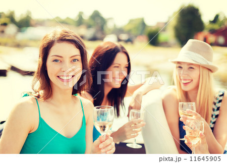 smiling girls with champagne glasses 11645905