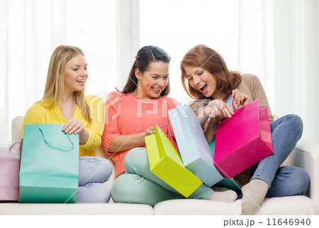 smiling teenage girls with many shopping bags smiling teenage girls with many shopping bags 11646940