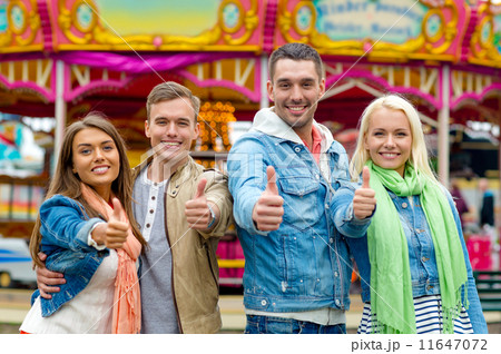 group of smiling friends showing thumbs up group of smiling friends showing thumbs up 11647072
