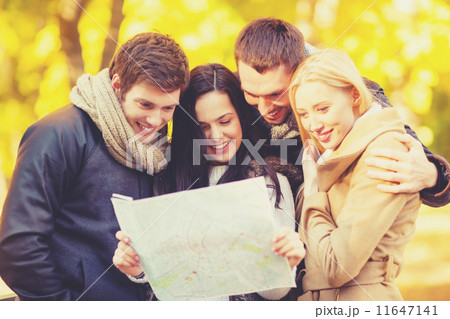 couples with tourist map in autumn park 11647141