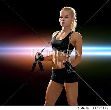 sporty woman with skipping rope 11647145
