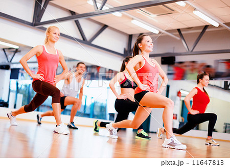group of smiling people exercising in the gym group of smiling people exercising in the gym 11647813