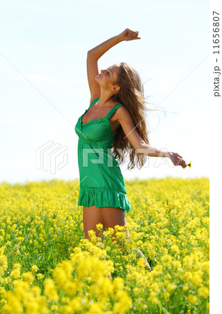 woman on oilseed field 11656807
