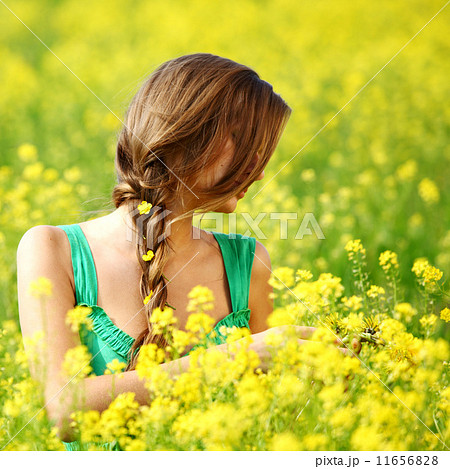 woman on oilseed field 11656828