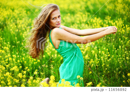 woman on oilseed field 11656892